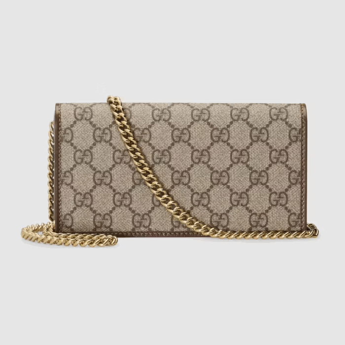 defined by the double ring and bar design also found in Handbags. The folded snap-closure shape features several card slots and pockets