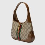 detachable shoulder strap. Attached to the bag with a buckle closure