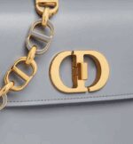 like the 30 Montaigne signature embossed on the back and the signature chain alternating gold-finish metal and tonal enamel links that match the leather. The gusseted bag features a spacious and refined silhouette that can be carried by hand