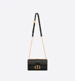 sans-serif; background-color: #f6f6f6;">The East-West bag with chain enhances the 30 Montaigne line with a timeless and elegant design crafted in black calfskin. The flap has an antique gold-finish metal CD clasp