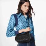 mini hobo style in Monogram Empreinte leather. With its sleek lines