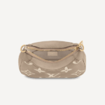 grained Monogram Empreinte leather. The embossed motif is oversized