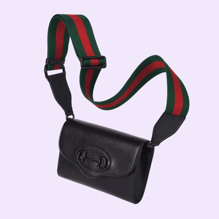 one is crafted in emblematic green and red Web the other is in Gucci’s recognizable chain design. The style is crafted from black leather and defined by the line's signature Horsebit hardware.