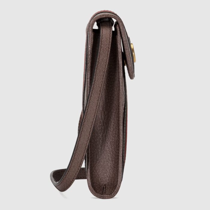 with a magnetic flap closure and removable snap button shoulder strap. First developed by Gucci in the 1950s