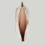 it's further enriched with antique gold-toned details.