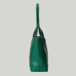 providing versatile accessories to complete any look. Two handles transform this tote bag