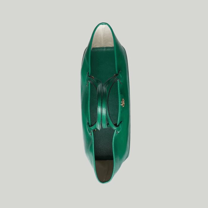allowing it to be styled either as a shoulder bag or top handle. The Double G remains integral to the design
