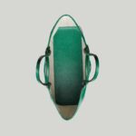 presented across a soft green leather base.
