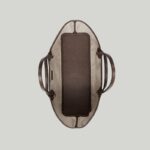 presented in GG Supreme canvas with a brown leather trim.