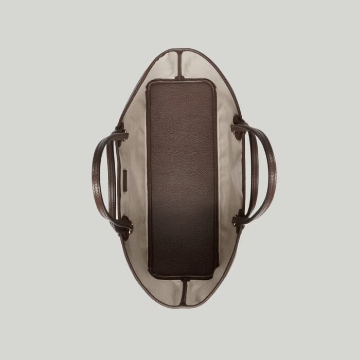 presented in GG Supreme canvas with a brown leather trim.