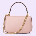 enriching the design with a timeless feel. The light pink leather mini bag is completed by two interchangeable shoulder straps