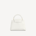 the now-classic Capucines BB handbag displays a host of House signatures: leather-wrapped LV Initials