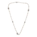 This imitation pearl long necklace features a crystal CC logo pendant throughout with an adjustable lobster claw clasp.