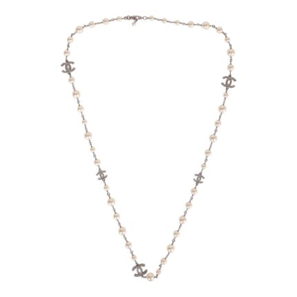 This imitation pearl long necklace features a crystal CC logo pendant throughout with an adjustable lobster claw clasp.