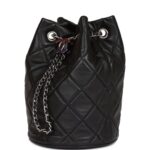 The interior is lined in black leather with one slip pocket on the rear wall.