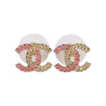 These CC logo earrings are in?gold tone metal with pink and?gold crystals.