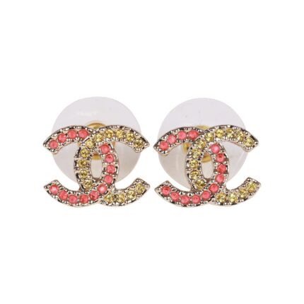 These CC logo earrings are in?gold tone metal with pink and?gold crystals.