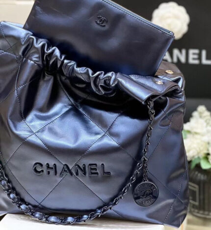 This Small 22 hobo bag is of SO black calfskin with black hardware and has the signature diamond quilting