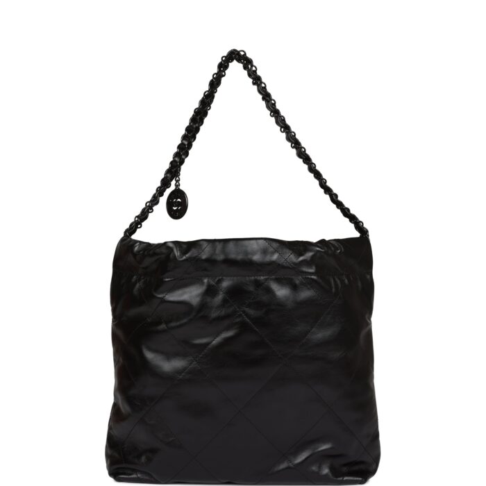 and long black metal and black leather chain.