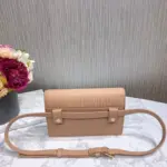 this versatile pouch showcases the iconic ‘CD’ element at the front