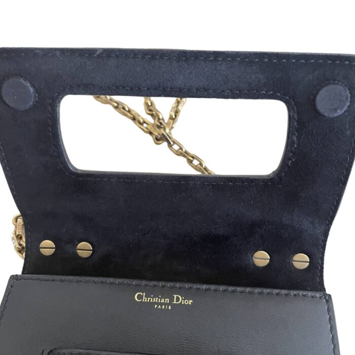 features a slot handclasp with metal plated J'ADIOR signature