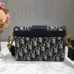 adding a touch of elegance. The leather shoulder strap is adjustable