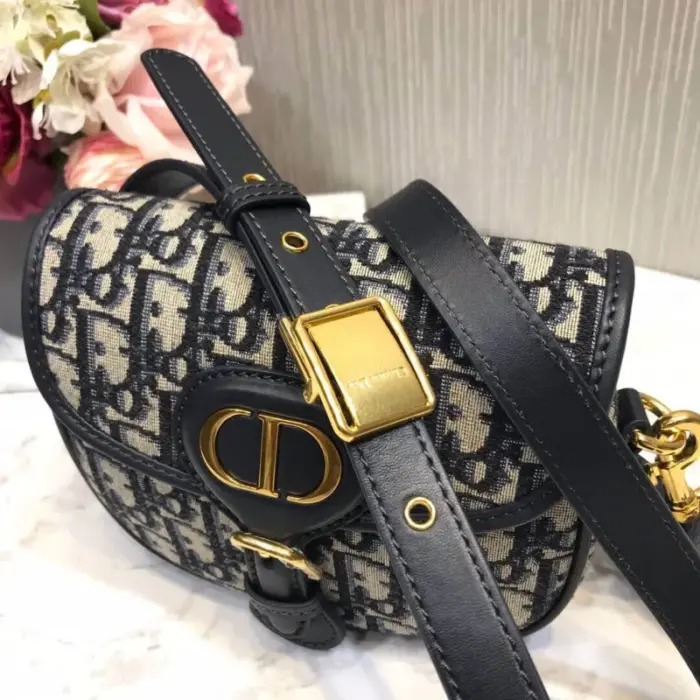 this bag comes with a dust bag for added protection and storage. Embrace the essence of Dior’s iconic 30 Montaigne collection with this stunning accessory. Elevate your style and make a statement with the Christian Dior Small Dior Bobby Bag in Blue Dior Oblique Jacquard M9317.