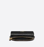 it reveals a 'CD' signature flap and several compartments to hold all the essentials. The removable chain allows it to be worn over the shoulder