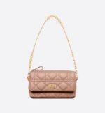 it reveals a 'CD' signature flap and several compartments to hold all the essentials. The removable chain allows it to be worn over the shoulder