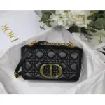 the Dior Caro bag showcases the iconic Cannage stitching that instantly catches the eye. Its supple structure features a flap adorned with an antique gold-finish metal twist ‘CD’ clasp