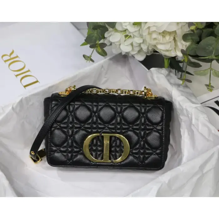 the Dior Caro bag showcases the iconic Cannage stitching that instantly catches the eye. Its supple structure features a flap adorned with an antique gold-finish metal twist ‘CD’ clasp