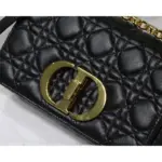 inspired by the seal of a Christian Dior perfume bottle. This intricate detail adds a touch of elegance to the bag.The bag comes with a removable signature ‘CD’ chain link shoulder strap that can be replaced with a wide embroidered strap. This versatility allows you to transition effortlessly from day to night