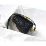 removable ‘CD’ chain link strap with a ‘CHRISTIAN DIOR’ military-inspired buckle. Additionally