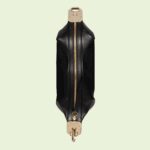classic elements from the House's archives are reintroduced. Distinguished by its crescent moon shape