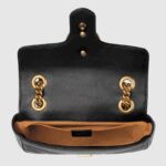 changing between a shoulder and a top handle bag. Made in matelassé chevron leather with a heart on the back.