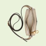 with retro-inspired details and classic brand elements. This mini bag is crafted in beige and white GG Supreme canvas with classic white leather piping and red and green striped web intarsia. The double G element adds more charm to the whole look.