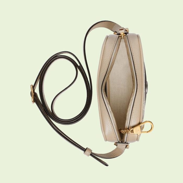 with retro-inspired details and classic brand elements. This mini bag is crafted in beige and white GG Supreme canvas with classic white leather piping and red and green striped web intarsia. The double G element adds more charm to the whole look.