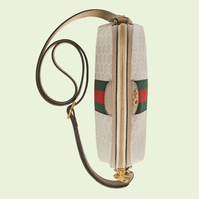 GG Supreme has been reimagined in Gucci Love Parade in different color combinations and combined with contemporary as well as classic styles. The Ophidia shoulder bag is presented in a beige and white variation of the signature material with a tonal trim. Originally a play on a '30s design