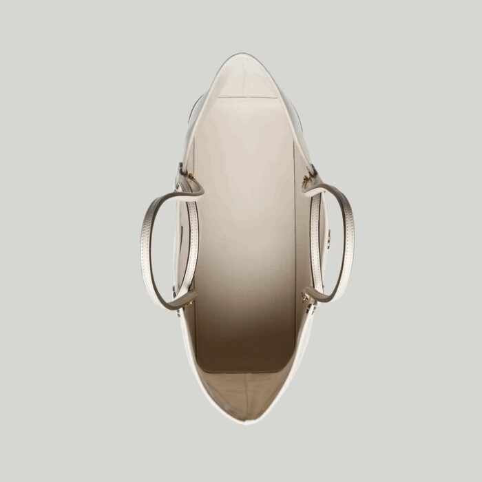 allowing it to be styled either as a shoulder bag or top handle. The Double G remains integral to the design