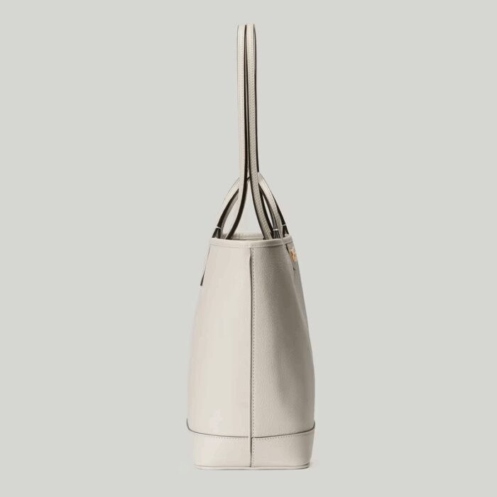 presented across an white leather base.