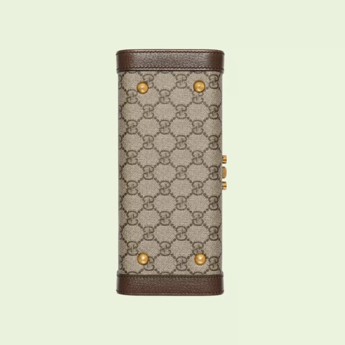 complete with brown leather trim. The elegant design features a lock and key