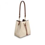 by hand with the removable top handle or over the shoulder and cross-body
