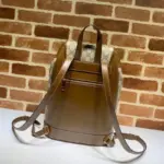 ensuring the security of your belongings. The adjustable leather straps offer a comfortable and personalized fit.The bag also showcases a front zippered pouch
