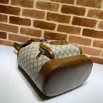 adorned with the signature double ring and bar design
