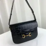 and 3.1 inches in depth.Crafted with the finest black crocodile material and complemented by elegant gold-toned hardware