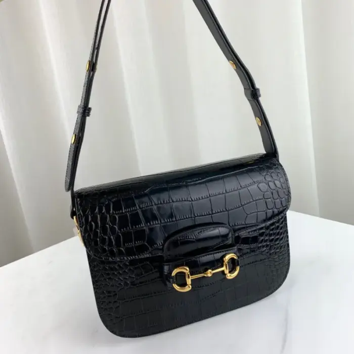 and 3.1 inches in depth.Crafted with the finest black crocodile material and complemented by elegant gold-toned hardware