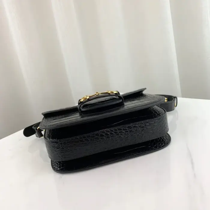 this exquisite shoulder bag exudes luxury and sophistication. The leather lining adds a touch of opulence to the design.Each bag comes with a convenient small pouch that includes two additional button covers. These covers can be used to protect the exposed studs when you lengthen the shoulder strap for added versatility.Featuring the iconic Horsebit detail at the front and a half Horsebit detail on each side