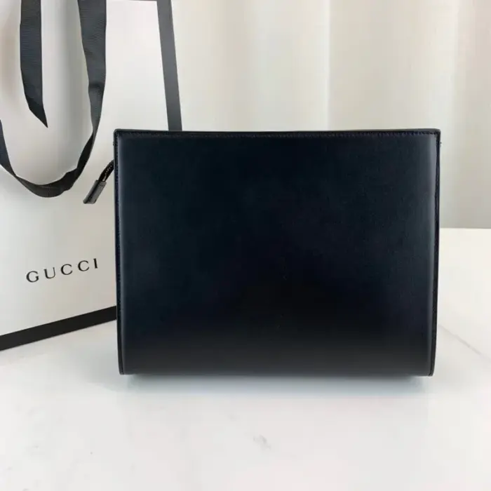 this pouch is spacious enough to hold all your essentials. It is crafted from high-quality leather and is complemented by elegant gold-toned hardware. The microfiber lining with a suede-like finish adds a touch of luxury to the overall design.The horsebit detail is a signature element of Gucci’s 1955 Horsebit collection