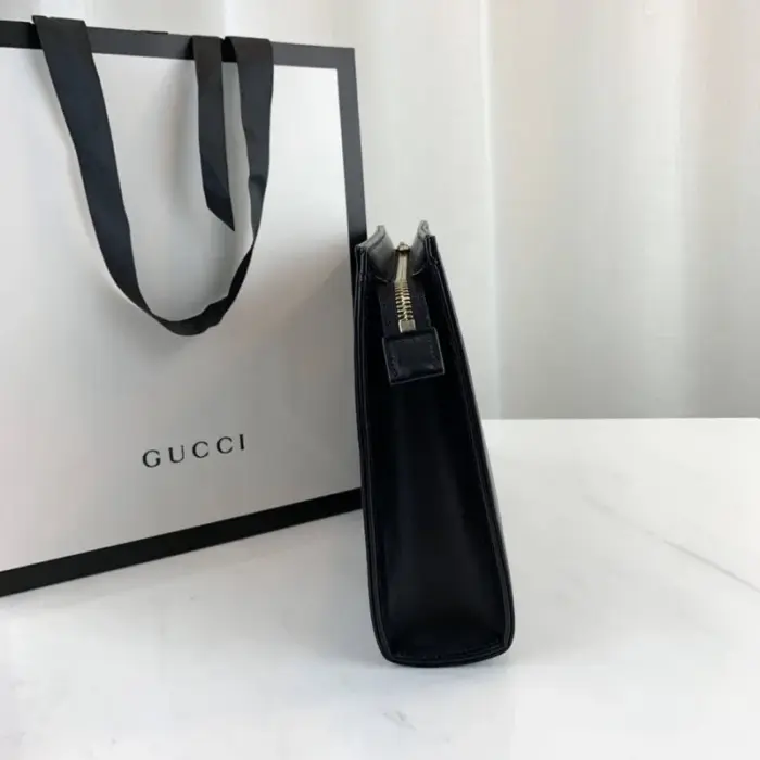 showcasing the brand’s timeless aesthetic. The pouch also includes a convenient open pocket for additional storage options.To keep your belongings secure