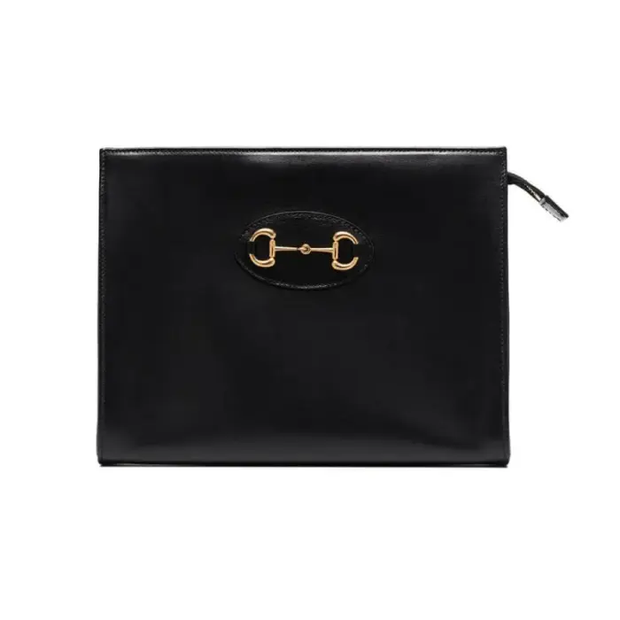 Introducing the stunning Gucci 1955 Horsebit-Embellished Leather Pouch 621890 in a perfect size of 10.2 W x 7.9 L x 2.8 D. There’s no need to compromise on style when you have this fabulous pouch by your side. It can be used as a makeup bag or a chic clutch